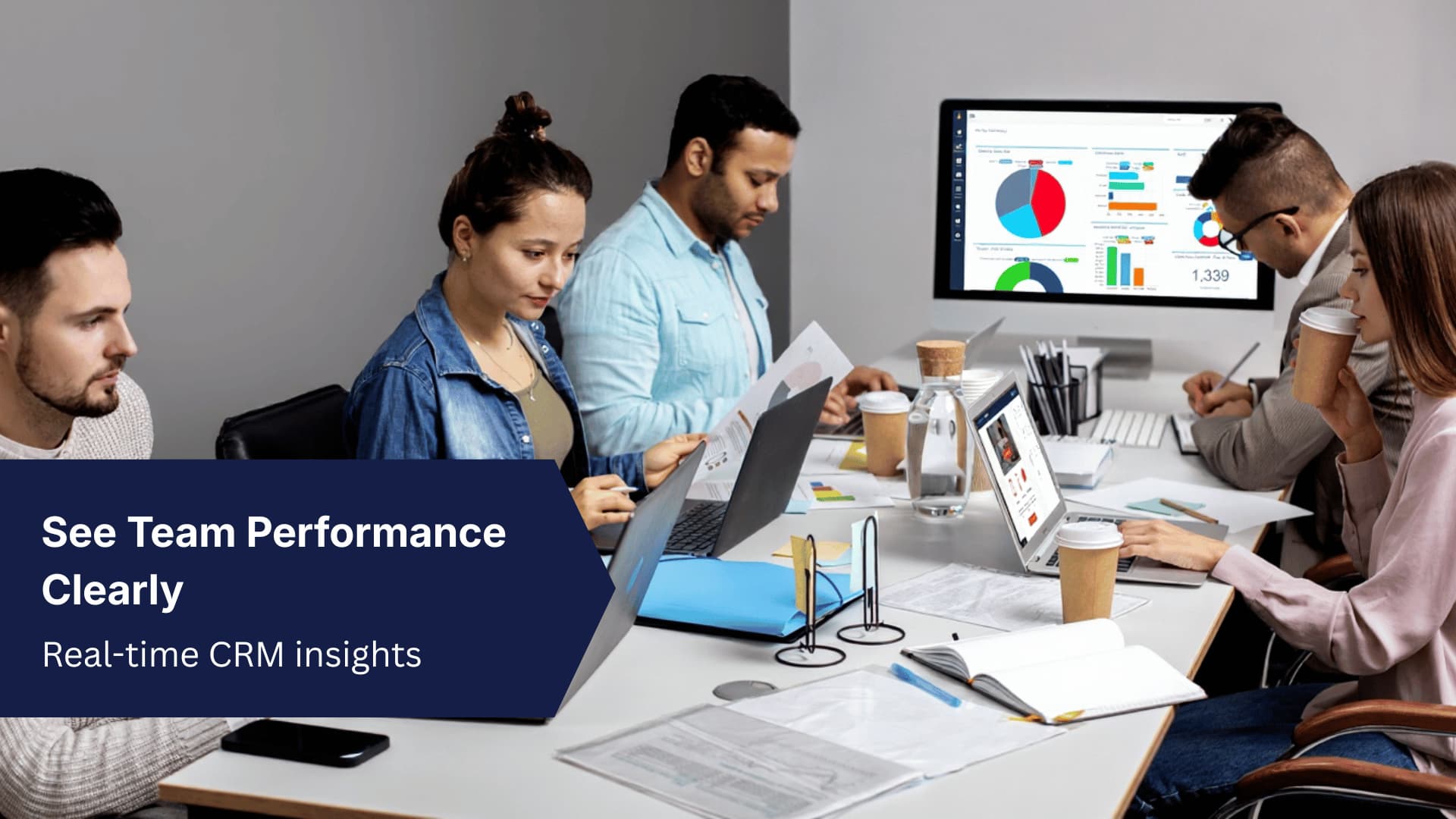 Team using CRM dashboards to monitor performance